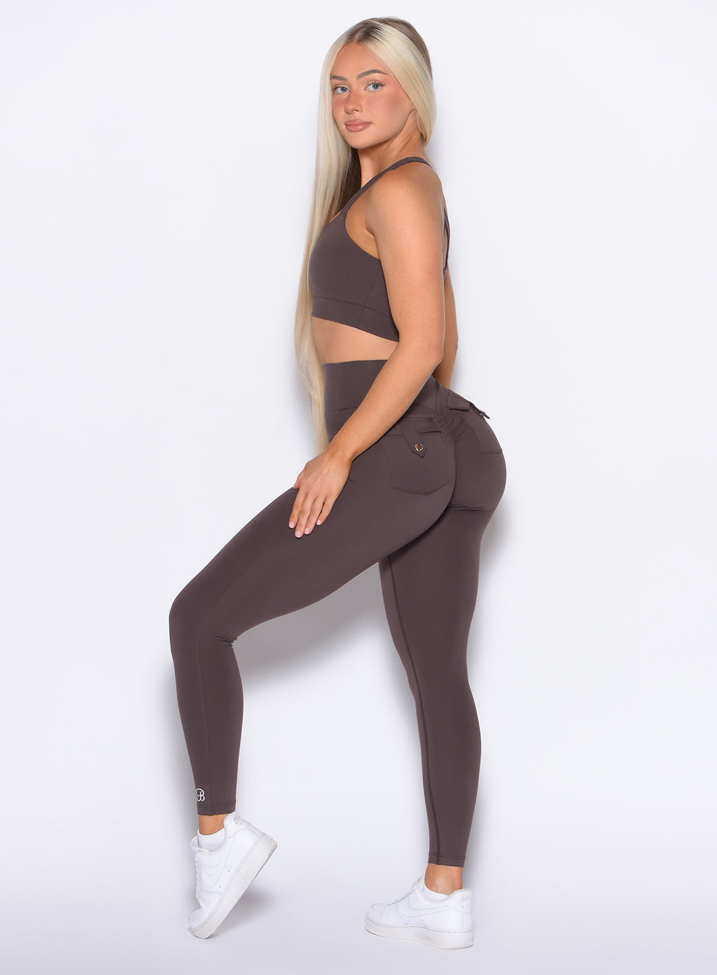 Left view of model wearing truffle brown activewear set